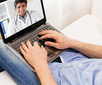 image of a guy on the computer talking with a doctor